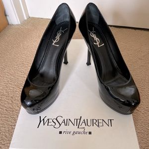 In like new condition. Gently worn. Yves Saint Laurent Heels in black. Size 8